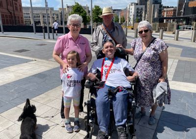 Photograph of family grouped together at Cardiff Bay.