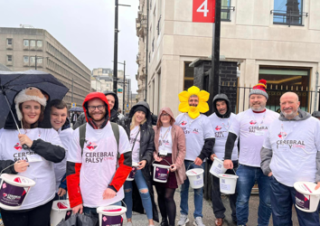 Group of volunteers holding buckets